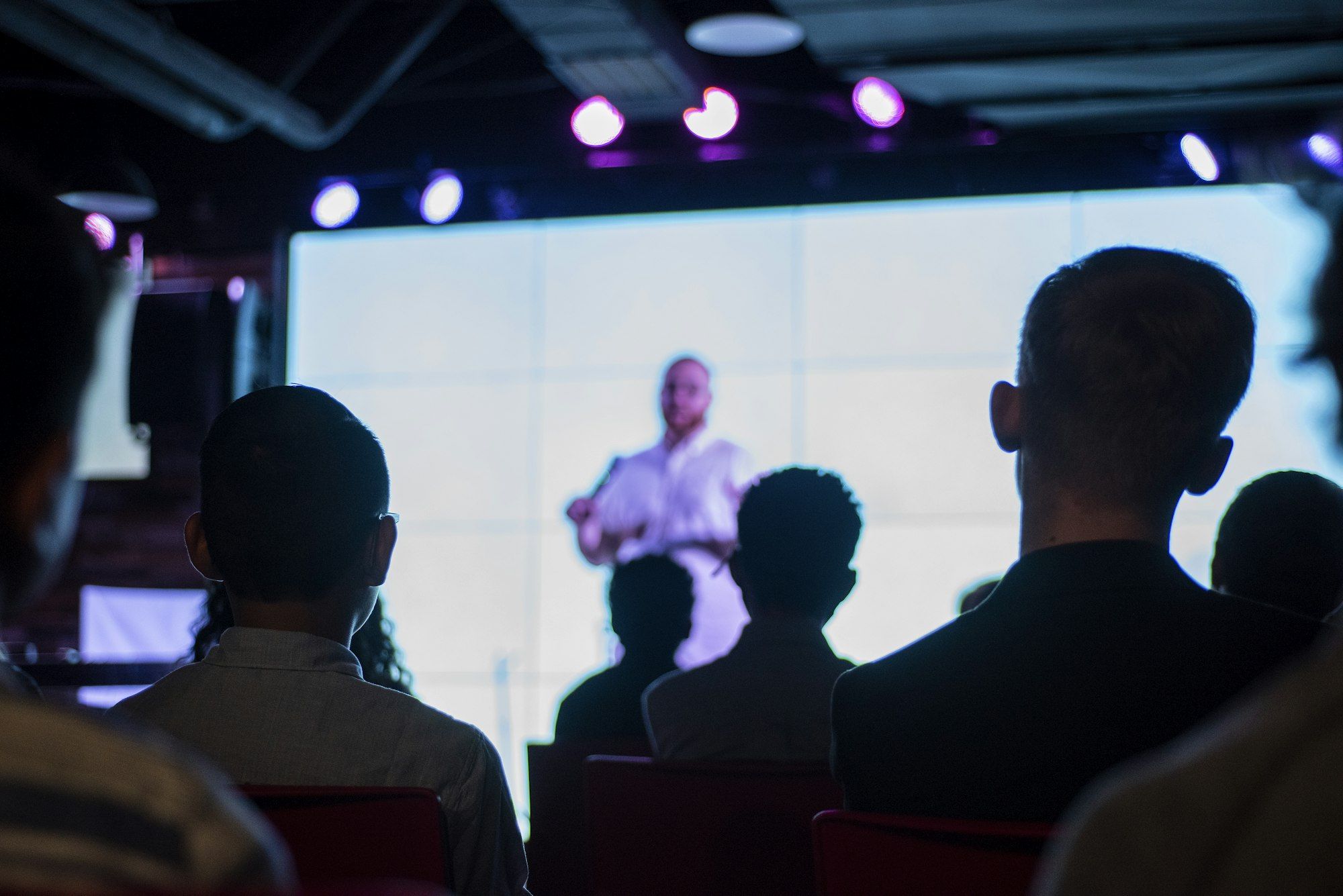 A leader addressing a room